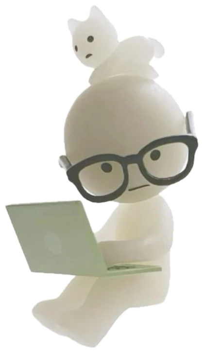 A little figure with glasses typing on a laptop, a cat on its head